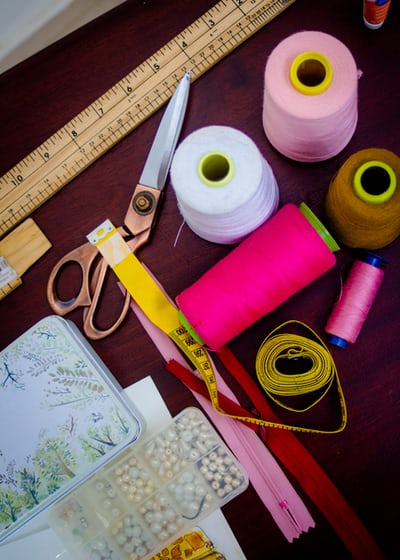 Sewing materials- thread,scissors,measuring tape,colors